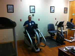 This is a picture of an FCHD employee on an exercise bike.